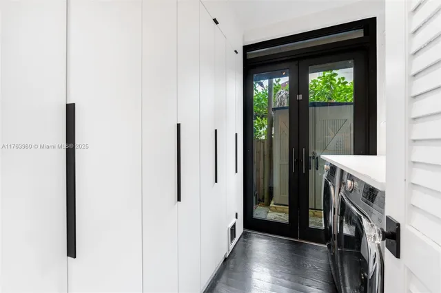 a view of an entryway with wooden floor
