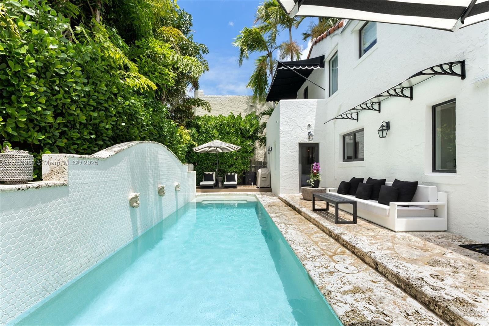 4430 Alton Road Miami Beach, FL 33140 - Photo 34 of 47 a view of a house with backyard and sitting area