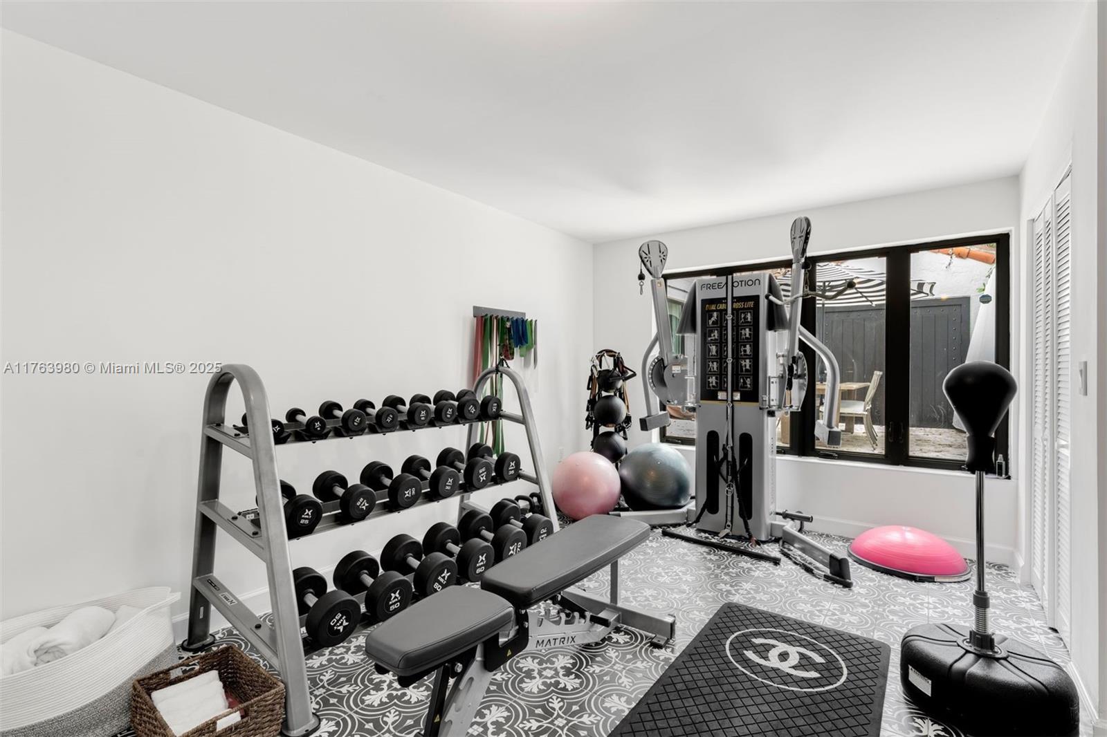 4430 Alton Road Miami Beach, FL 33140 - Photo 39 of 47 a bedroom with furniture and a window