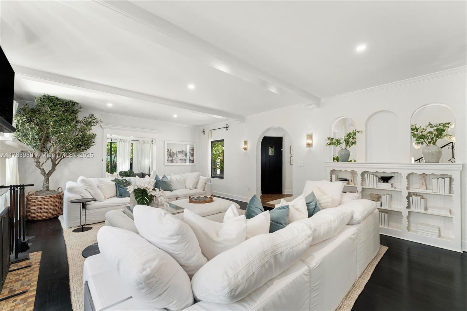 4430 Alton Road Miami Beach, FL 33140 - Photo 4 of 47 a living room with furniture and a flat screen tv
