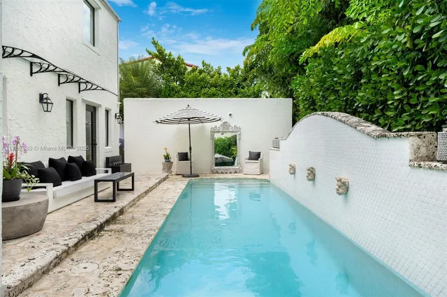 a view of a swimming pool with a patio