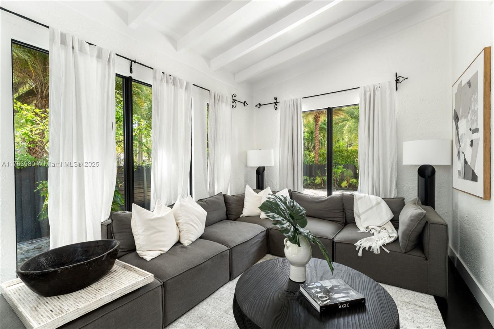 4430 Alton Road Miami Beach, FL 33140 - Photo 5 of 47 a living room with furniture and a large window