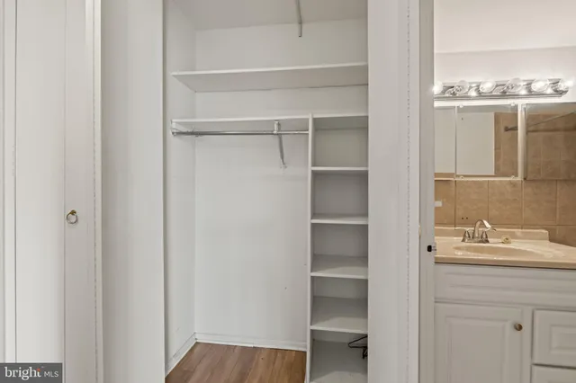 a view of a dining room with furniture and a book shelf