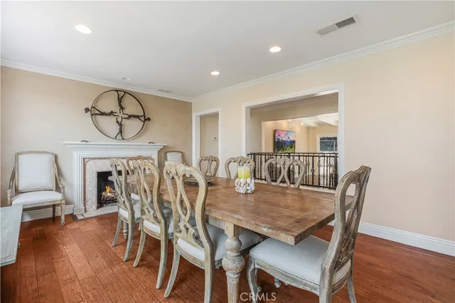a view of a dining room with furniture wooden floor and chandelier