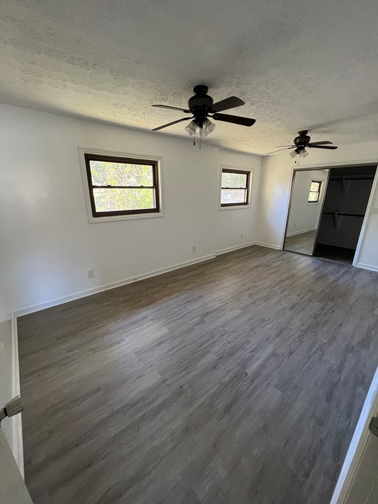 5220 Teresa Street Columbus, GA 31907 - Photo 14 of 21 a view of a big room with wooden floor and windows