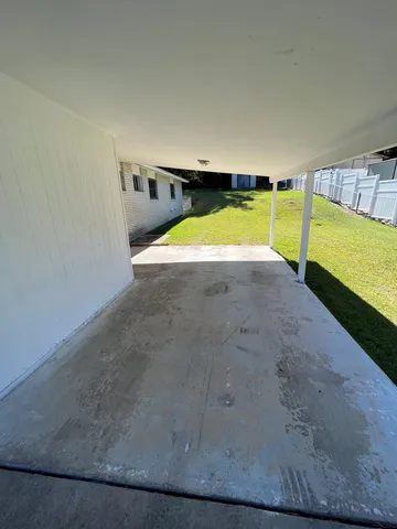 a view of swimming pool with furniture