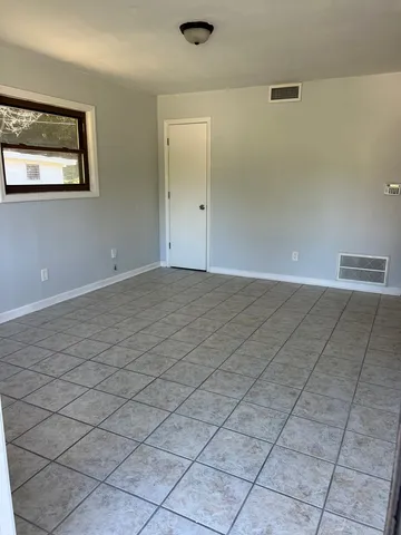 a view of an empty room and window