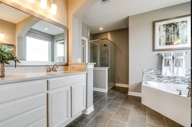 a kitchen with a stove and a white cabinet