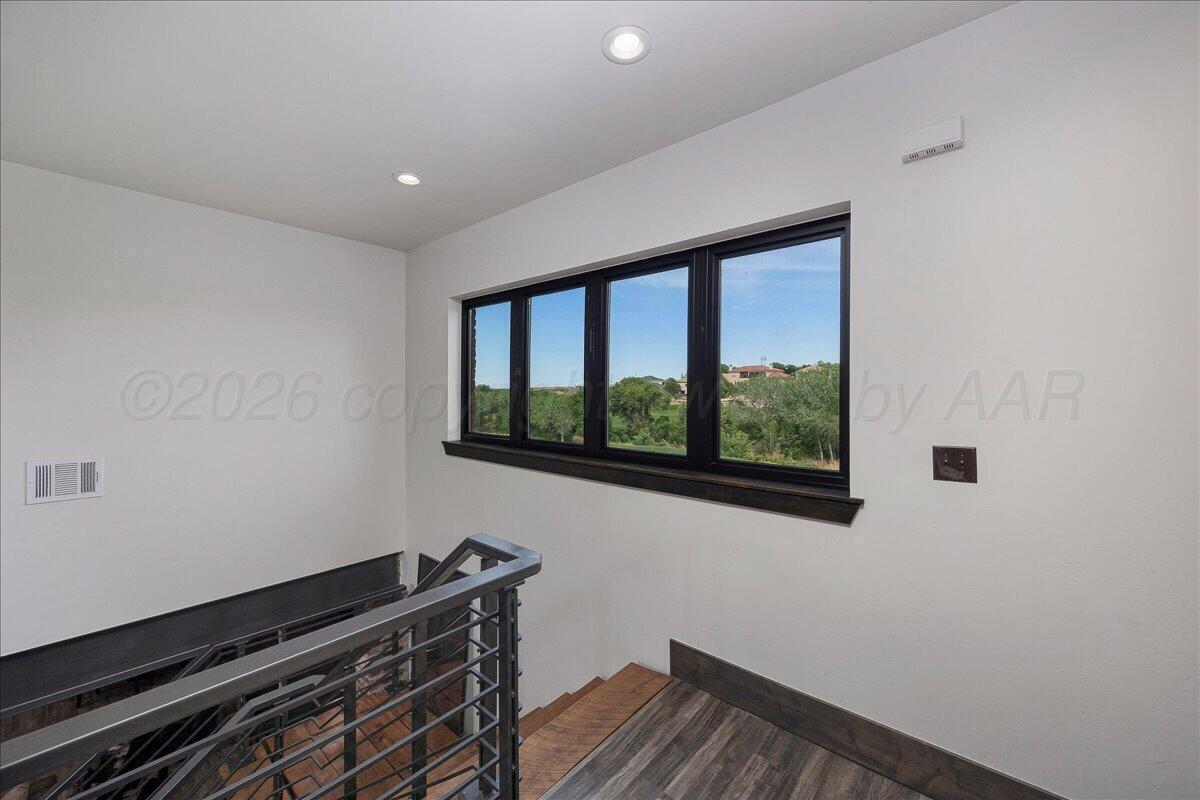 8 Cypress Point Amarillo, TX 79124 - Photo 28 of 43 a room with wooden floor and a window