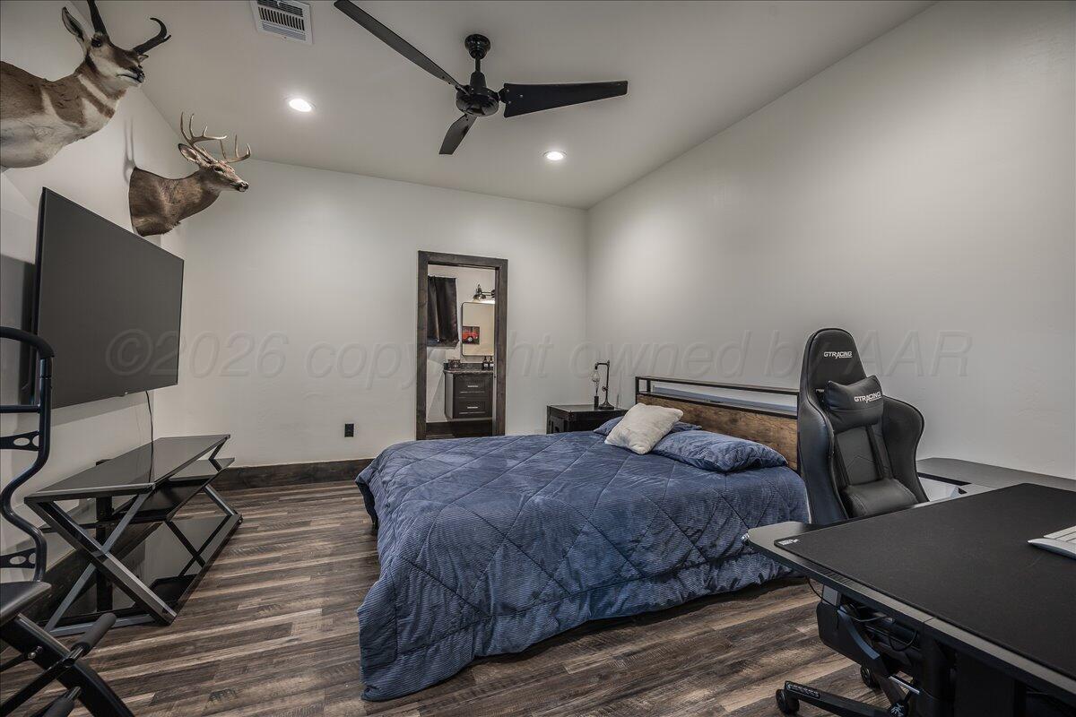 8 Cypress Point Amarillo, TX 79124 - Photo 31 of 43 a bedroom with a bed and a flat screen tv