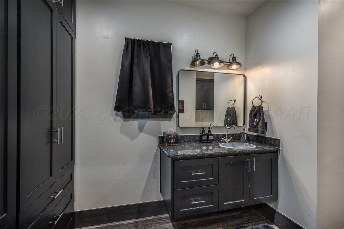 8 Cypress Point Amarillo, TX 79124 - Photo 32 of 43 a bathroom with a sink and a mirror