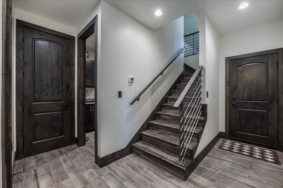 8 Cypress Point Amarillo, TX 79124 - Photo 33 of 43 a view of a hallway with entryway wooden floor and front door