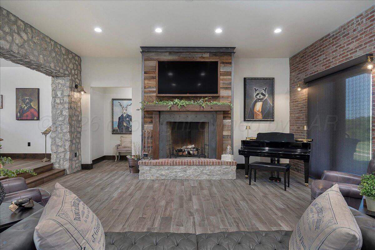 8 Cypress Point Amarillo, TX 79124 - Photo 6 of 43 a living room with furniture and a fireplace
