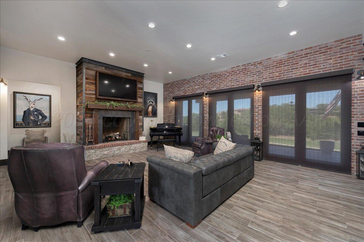 8 Cypress Point Amarillo, TX 79124 - Photo 7 of 43 a living room with furniture and a fireplace