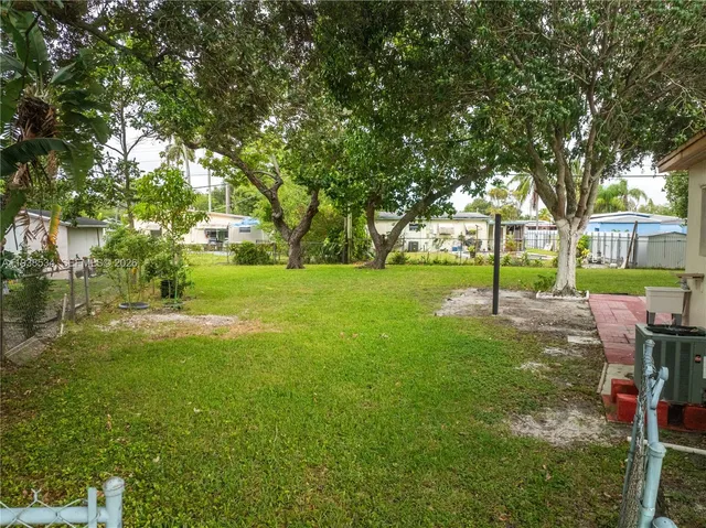 a view of a house with a back yard