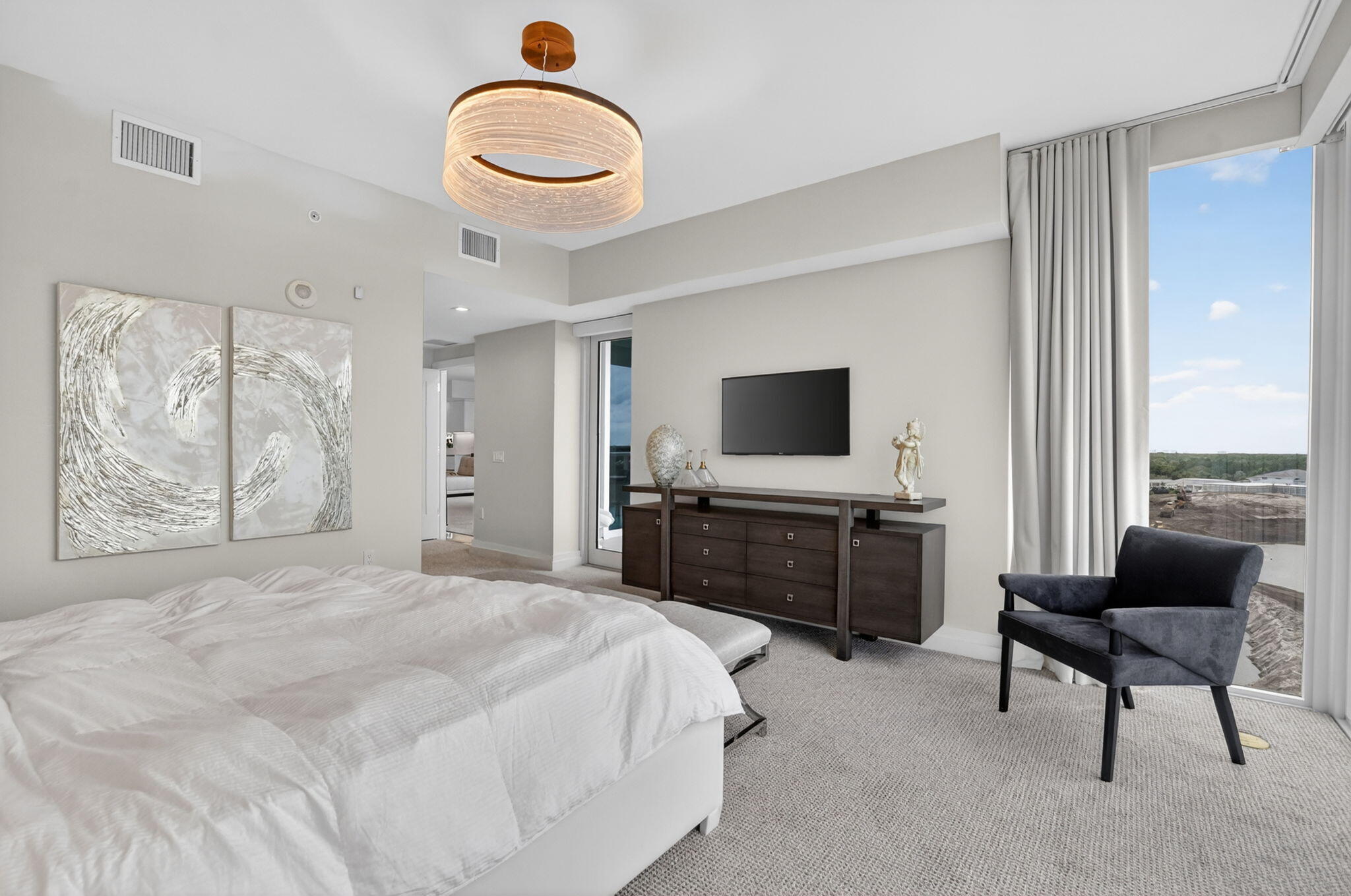 20155 Boca W Drive, Unit B701 Boca Raton, FL 33434 - Photo 21 of 78 a bedroom with furniture and a flat screen tv