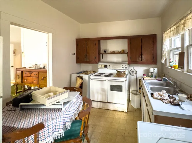 a white toilet sitting next to a bathroom sink and vanity