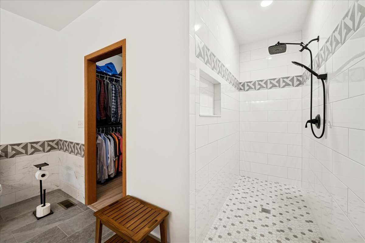 11605 Ellwood Greens Road Genoa, IL 60135 - Photo 13 of 25 a view of a hallway with closet and wooden floor