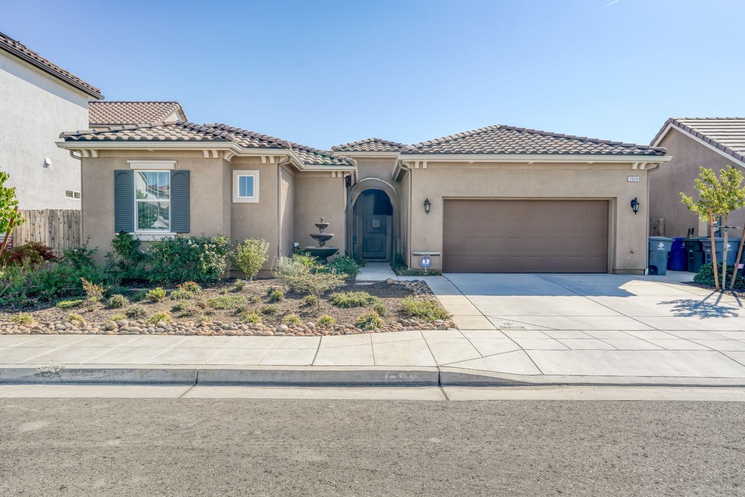 3048 Poe Avenue Clovis, CA 93619 - Photo 1 of 56 front view of a house