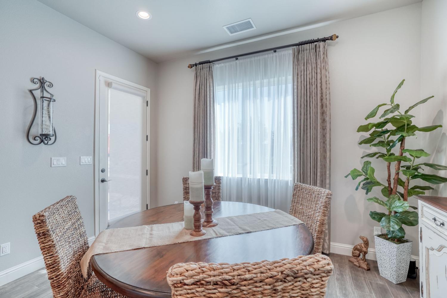3048 Poe Avenue Clovis, CA 93619 - Photo 21 of 56 a living room with furniture and a potted plant