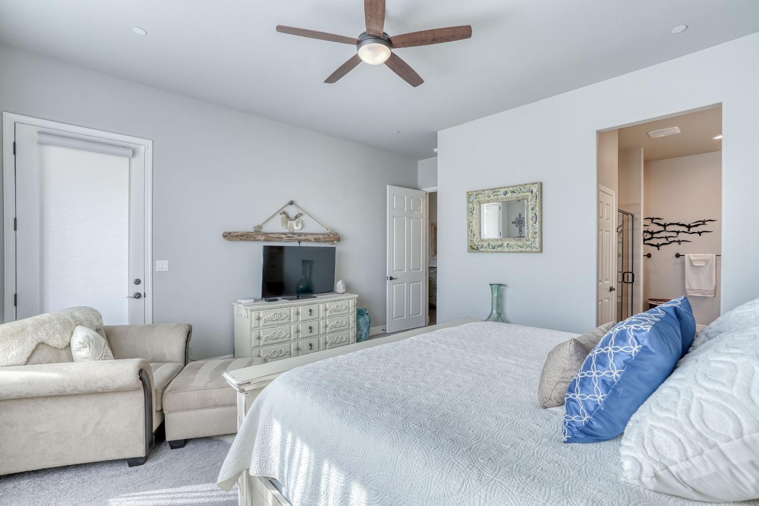 3048 Poe Avenue Clovis, CA 93619 - Photo 23 of 56 a bedroom with a bed couch and window