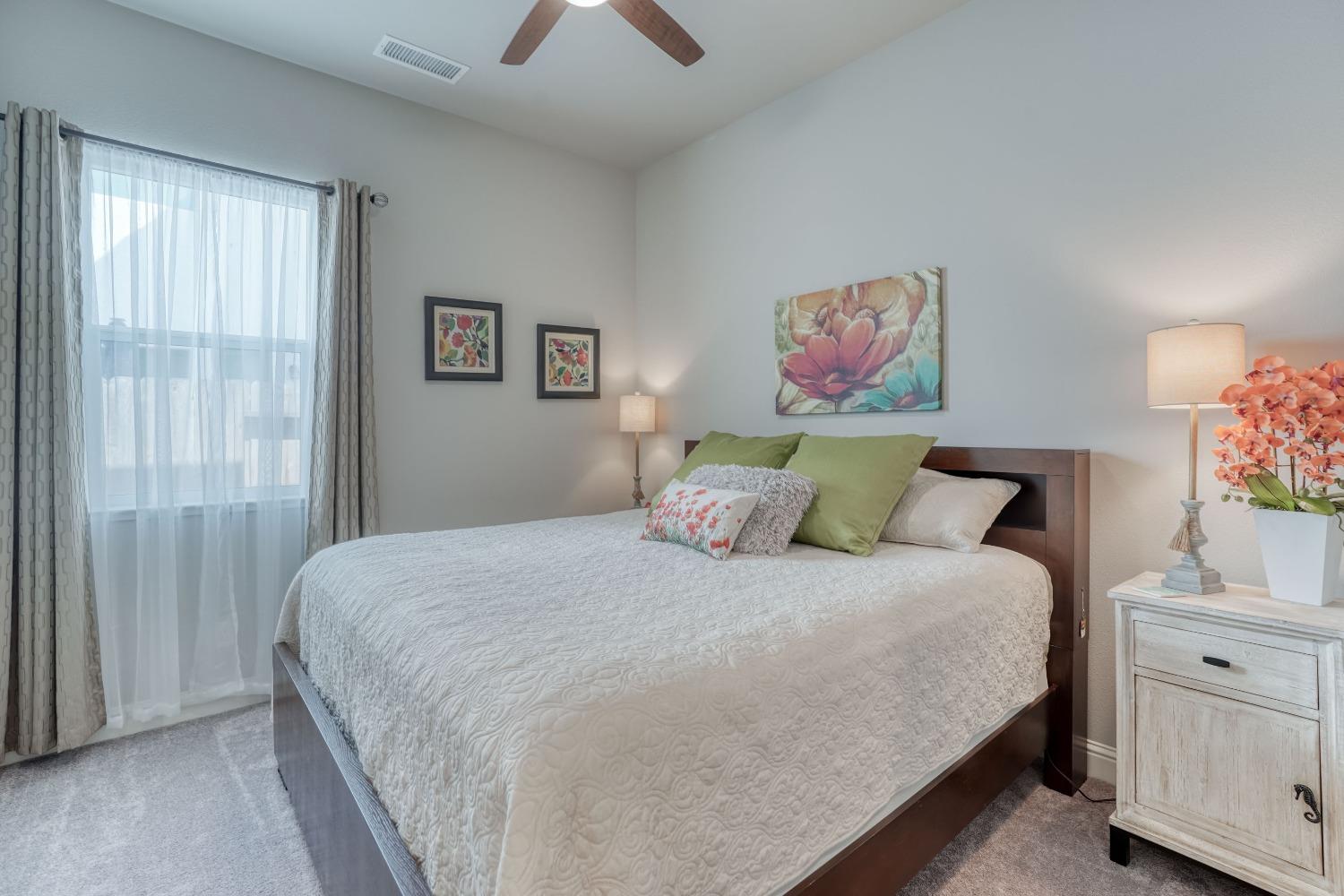 3048 Poe Avenue Clovis, CA 93619 - Photo 26 of 56 a bedroom with a bed and a window