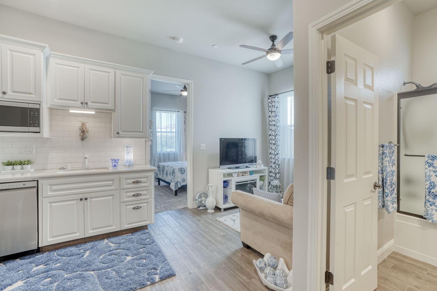 3048 Poe Avenue Clovis, CA 93619 - Photo 29 of 56 a large white kitchen with cabinets