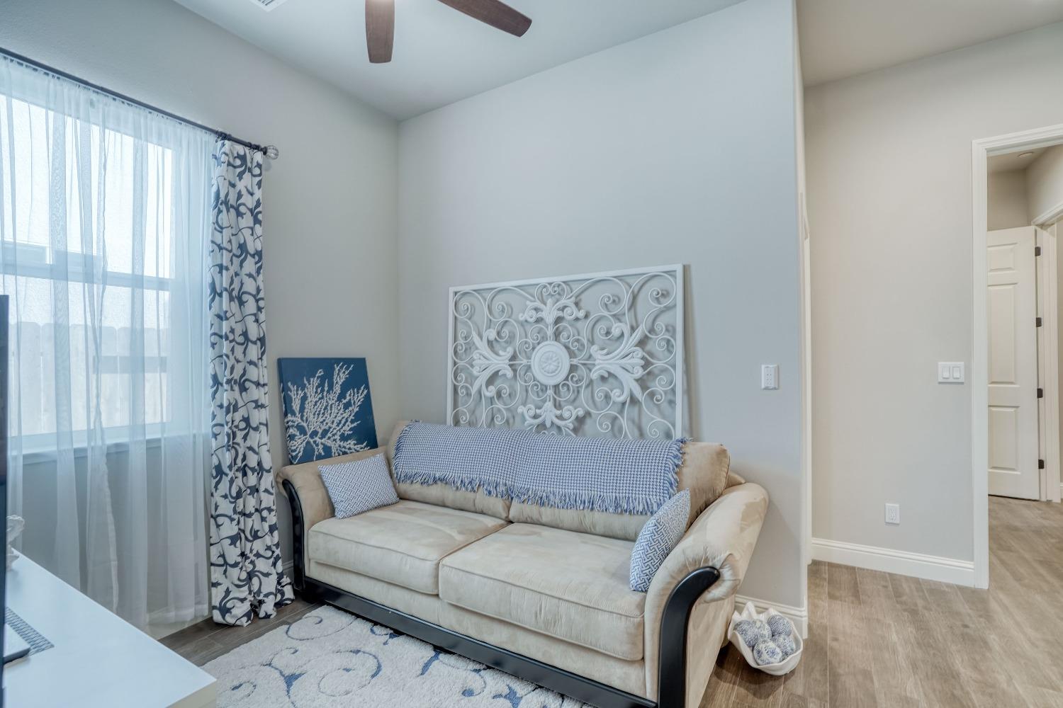 3048 Poe Avenue Clovis, CA 93619 - Photo 32 of 56 a living room with furniture and a window