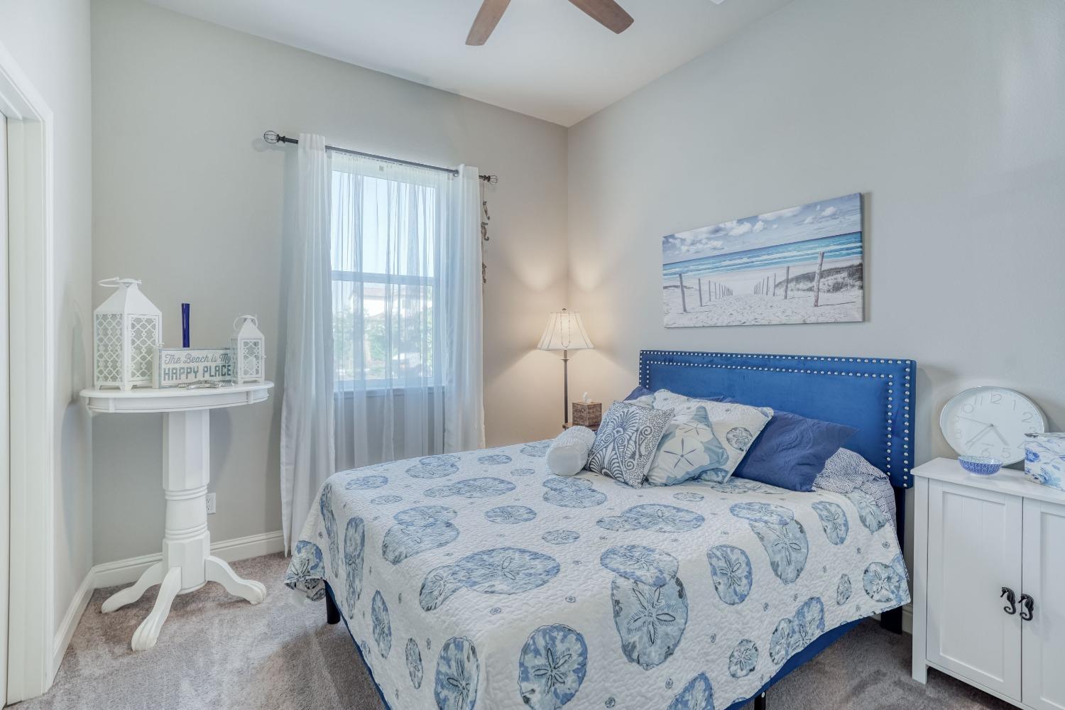 3048 Poe Avenue Clovis, CA 93619 - Photo 37 of 56 a bedroom with a large bed and a window