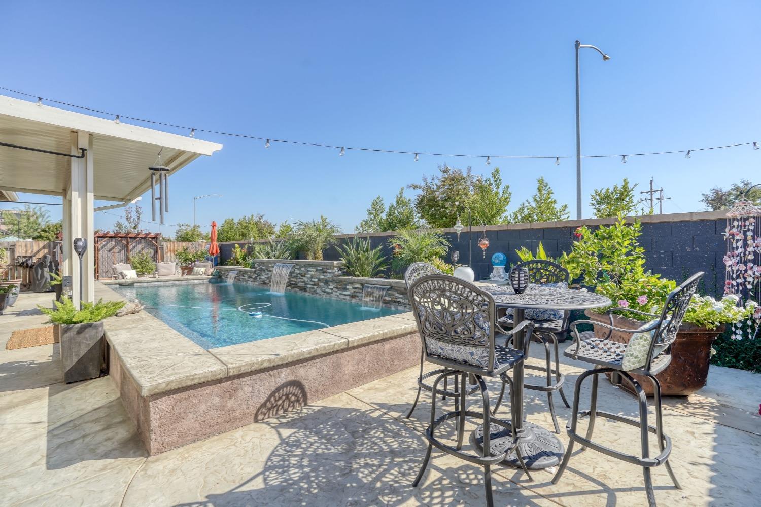 3048 Poe Avenue Clovis, CA 93619 - Photo 45 of 56 a view of a chairs and table in patio