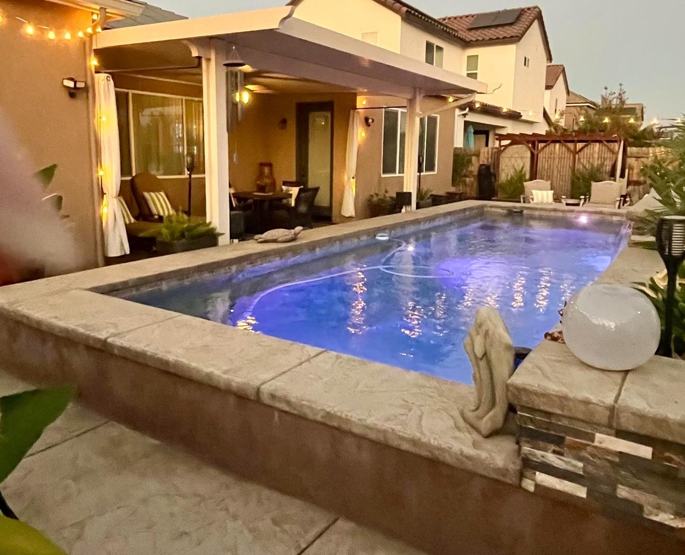 3048 Poe Avenue Clovis, CA 93619 - Photo 55 of 56 a view of a house with swimming pool and sitting area