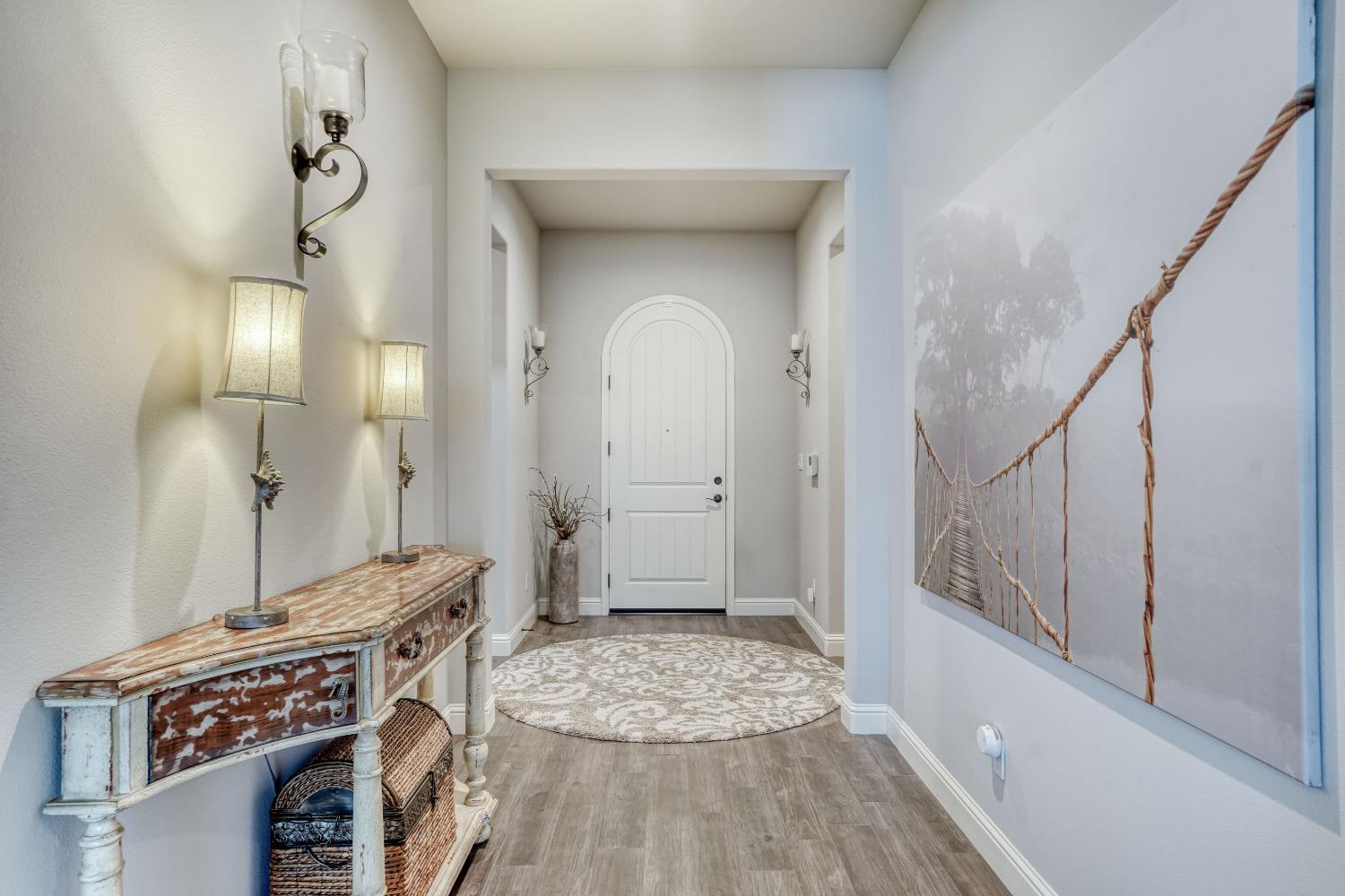 3048 Poe Avenue Clovis, CA 93619 - Photo 6 of 56 a view of a hallway with wooden floor and staircase