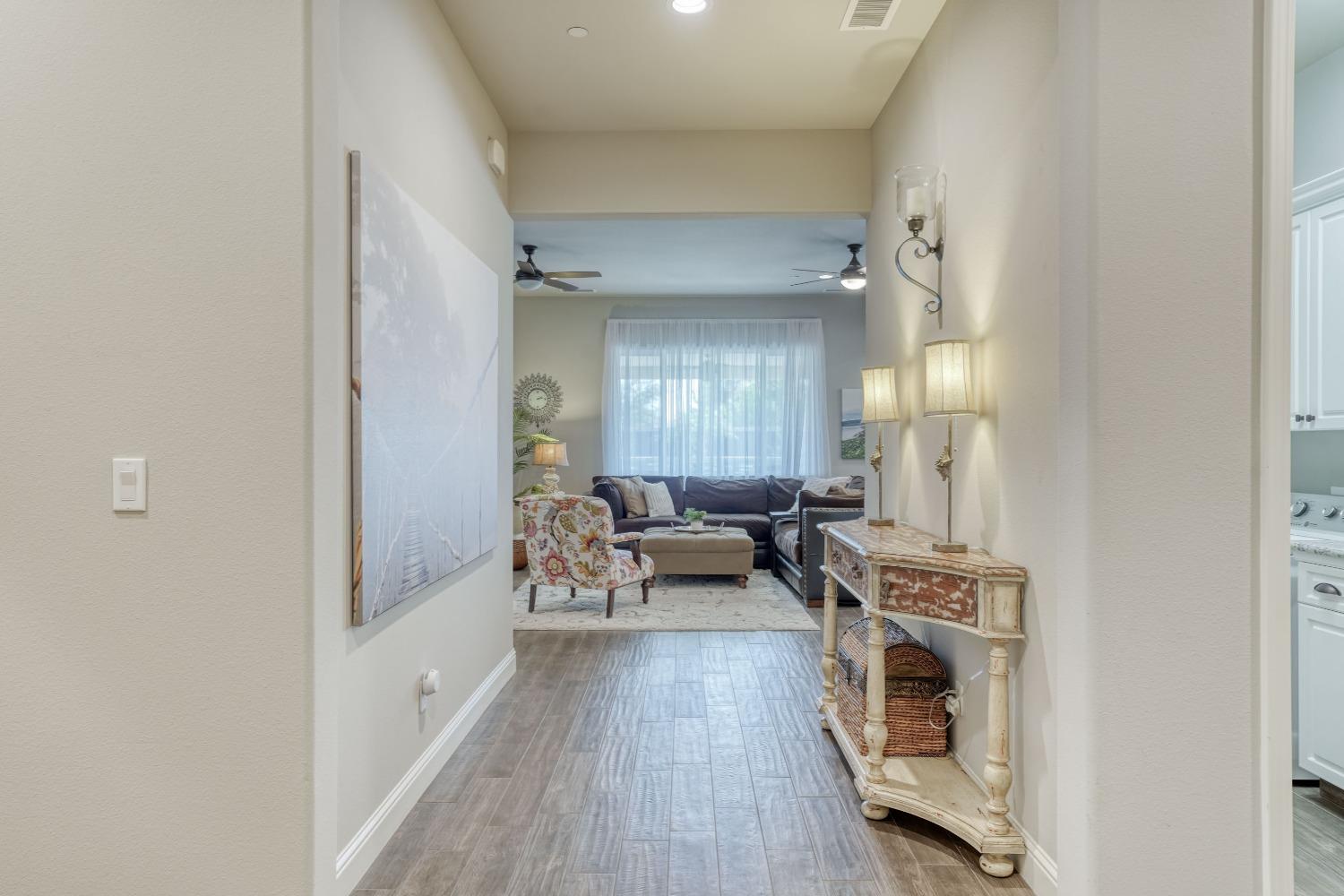 3048 Poe Avenue Clovis, CA 93619 - Photo 7 of 56 a living room with furniture and a fireplace