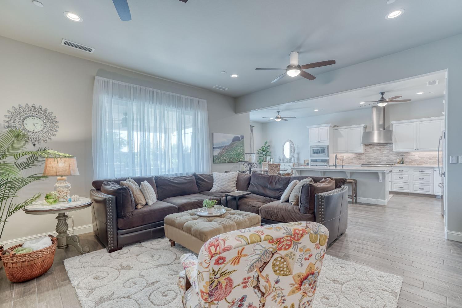 3048 Poe Avenue Clovis, CA 93619 - Photo 8 of 56 a living room with furniture and a large window