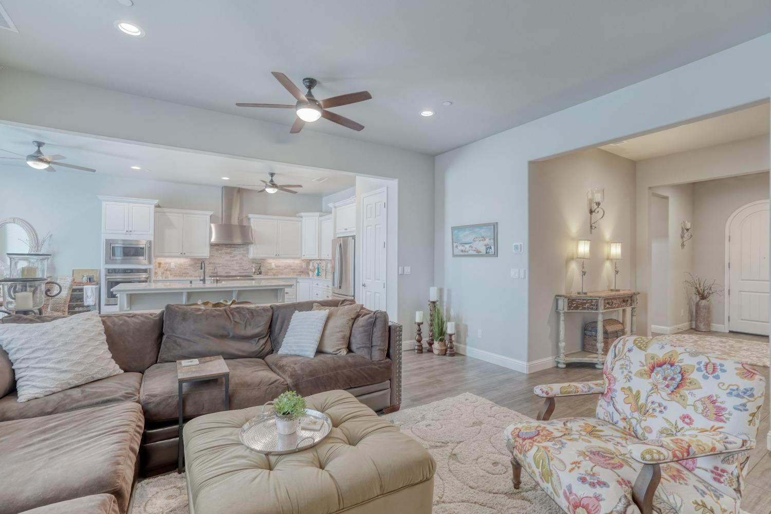 3048 Poe Avenue Clovis, CA 93619 - Photo 10 of 56 a living room with furniture and a view of kitchen
