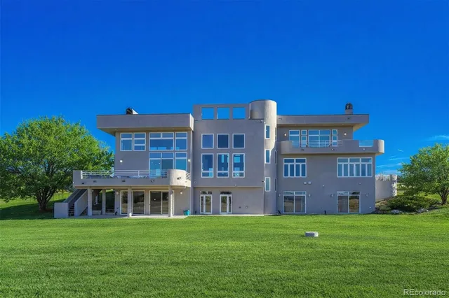a front view of a building with garden