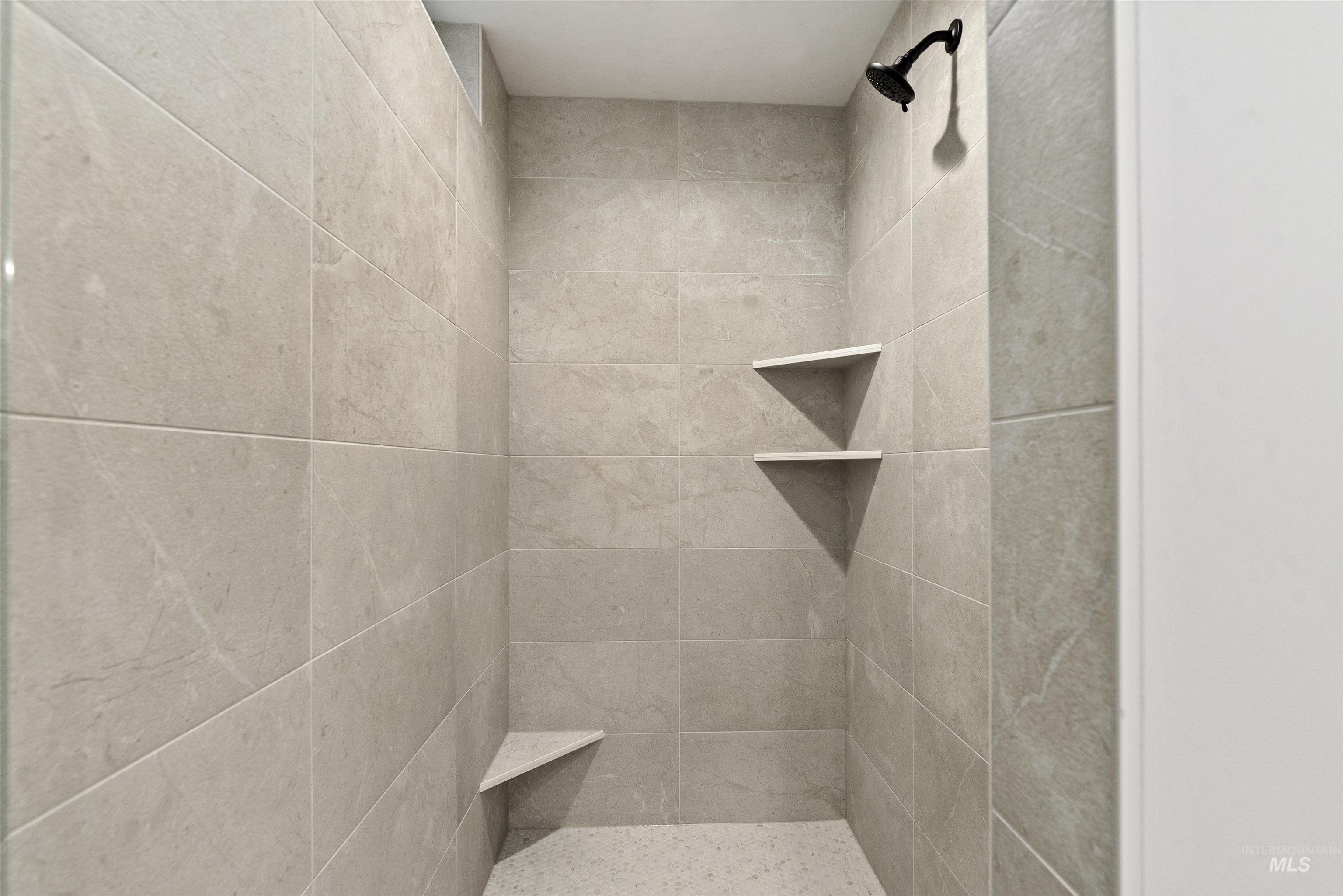 2129 East Blakehurst Street Kuna, ID 83634 - Photo 18 of 34 Bathroom featuring tiled shower