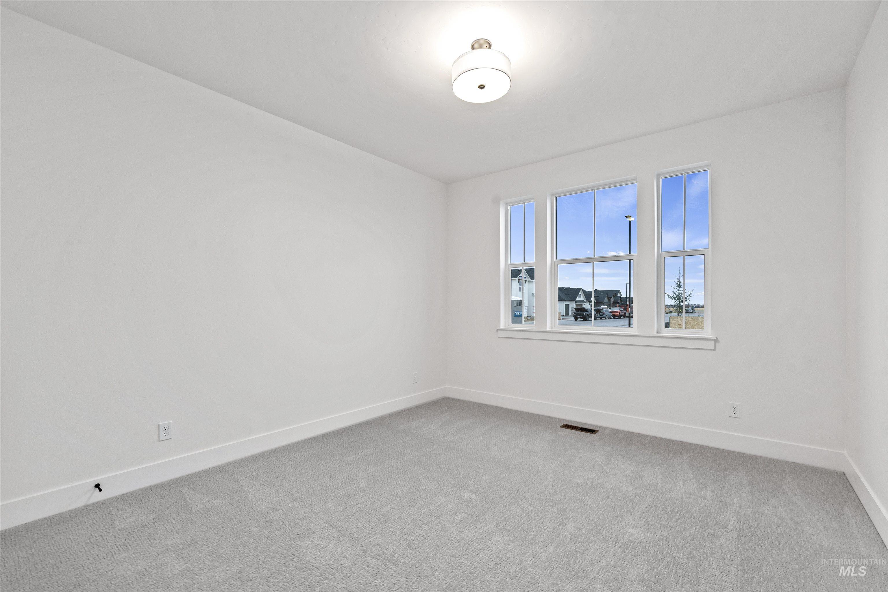 2129 East Blakehurst Street Kuna, ID 83634 - Photo 22 of 34 Carpeted empty room with baseboards