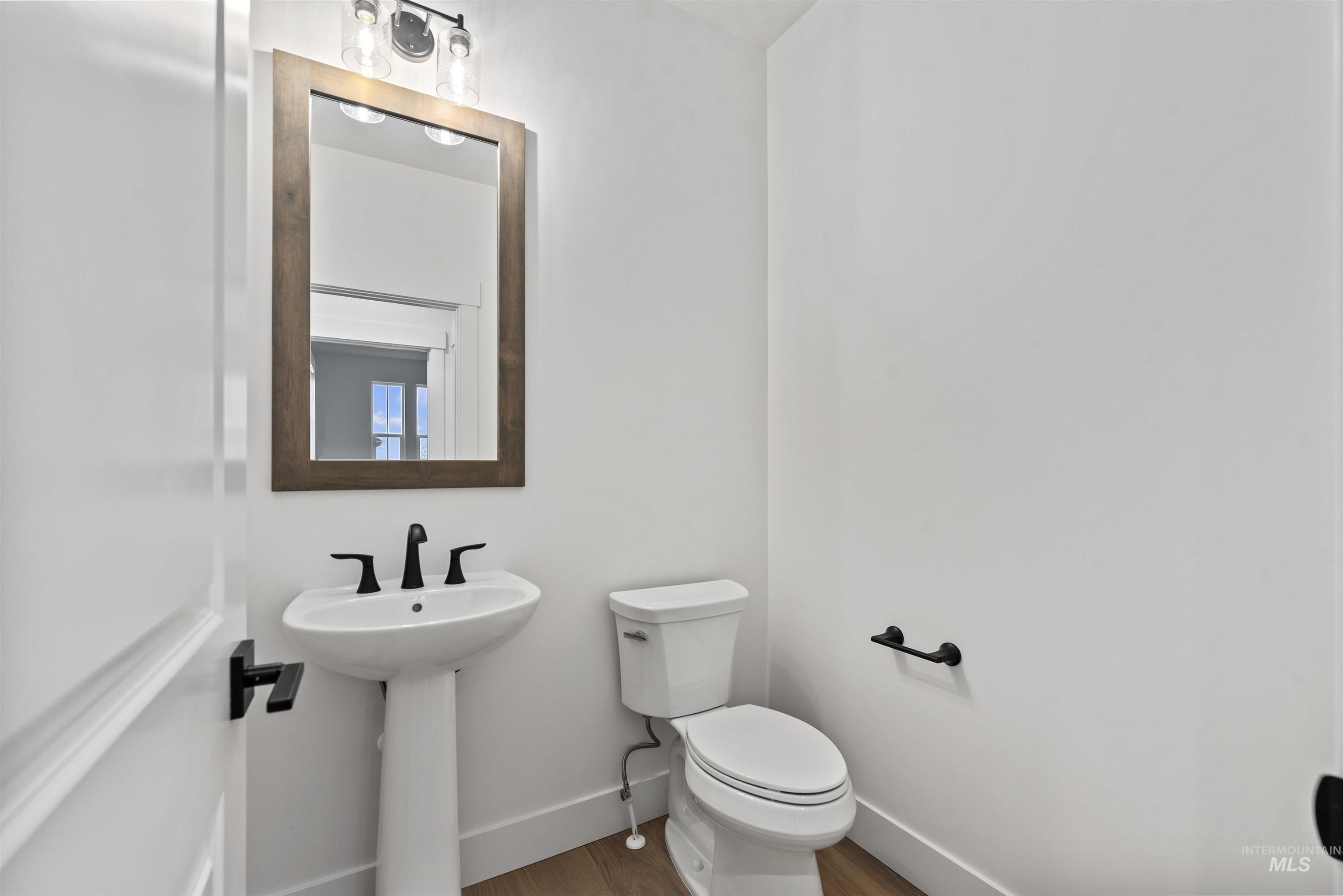 2129 East Blakehurst Street Kuna, ID 83634 - Photo 24 of 34 Bathroom with toilet and wood finished floors