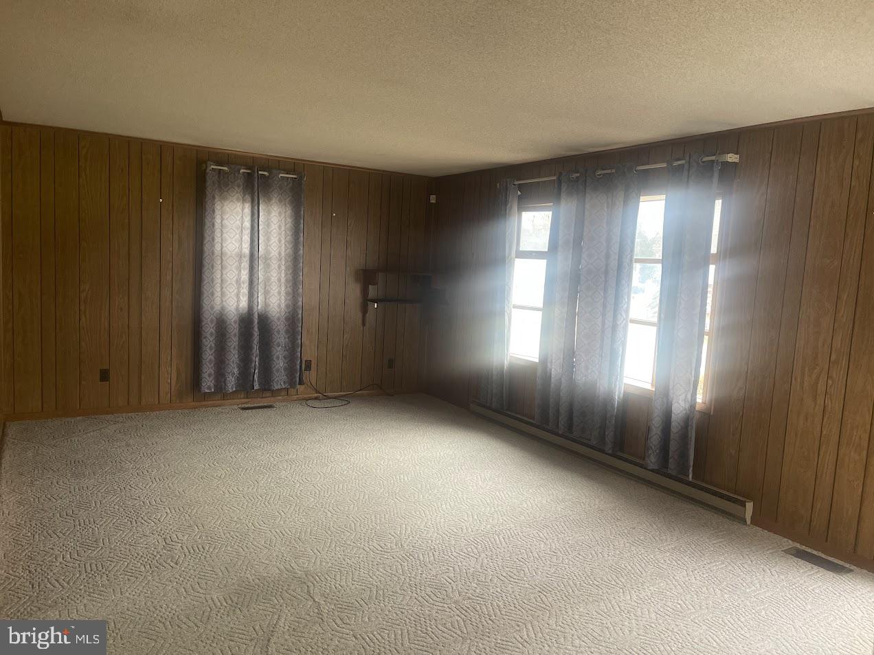 204 East Adams Street Georgetown, DE 19947 - Photo 15 of 18 an empty room with stairs and windows