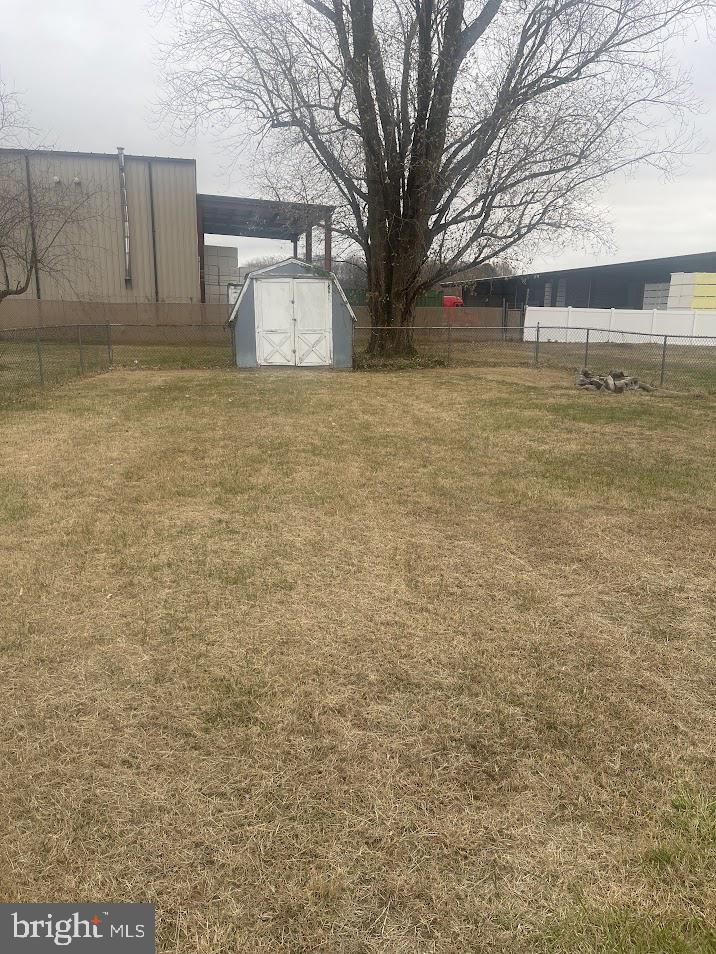 204 East Adams Street Georgetown, DE 19947 - Photo 2 of 18 a view of a yard with a bench