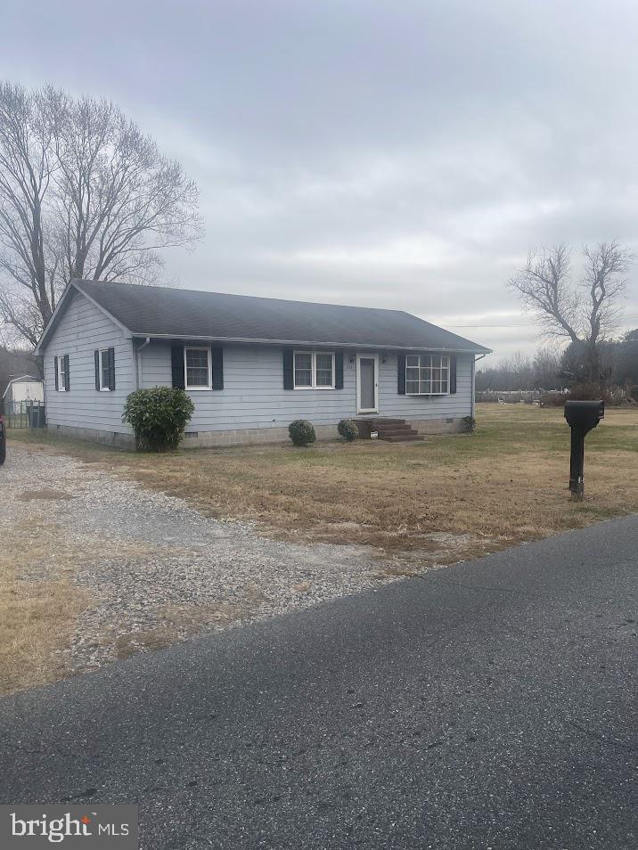 204 East Adams Street Georgetown, DE 19947 - Photo 8 of 18 a front view of house with yard and trees around