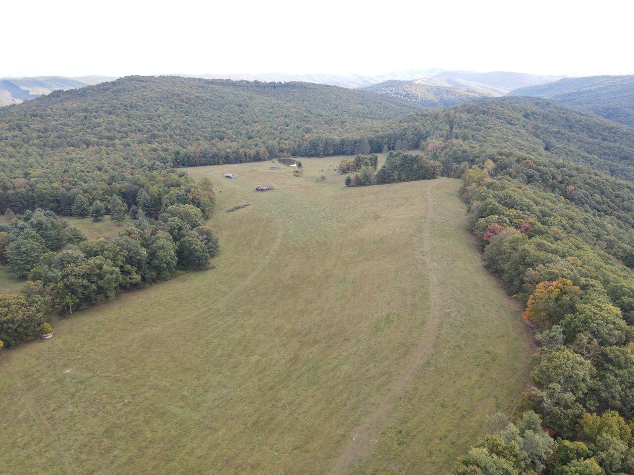 0 Kates Mountain Road White Sulphur Springs, WV 24983 - Photo 17 of 28 a view of a dry field with mountains in the background