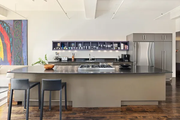 a kitchen with stainless steel appliances a refrigerator and a stove
