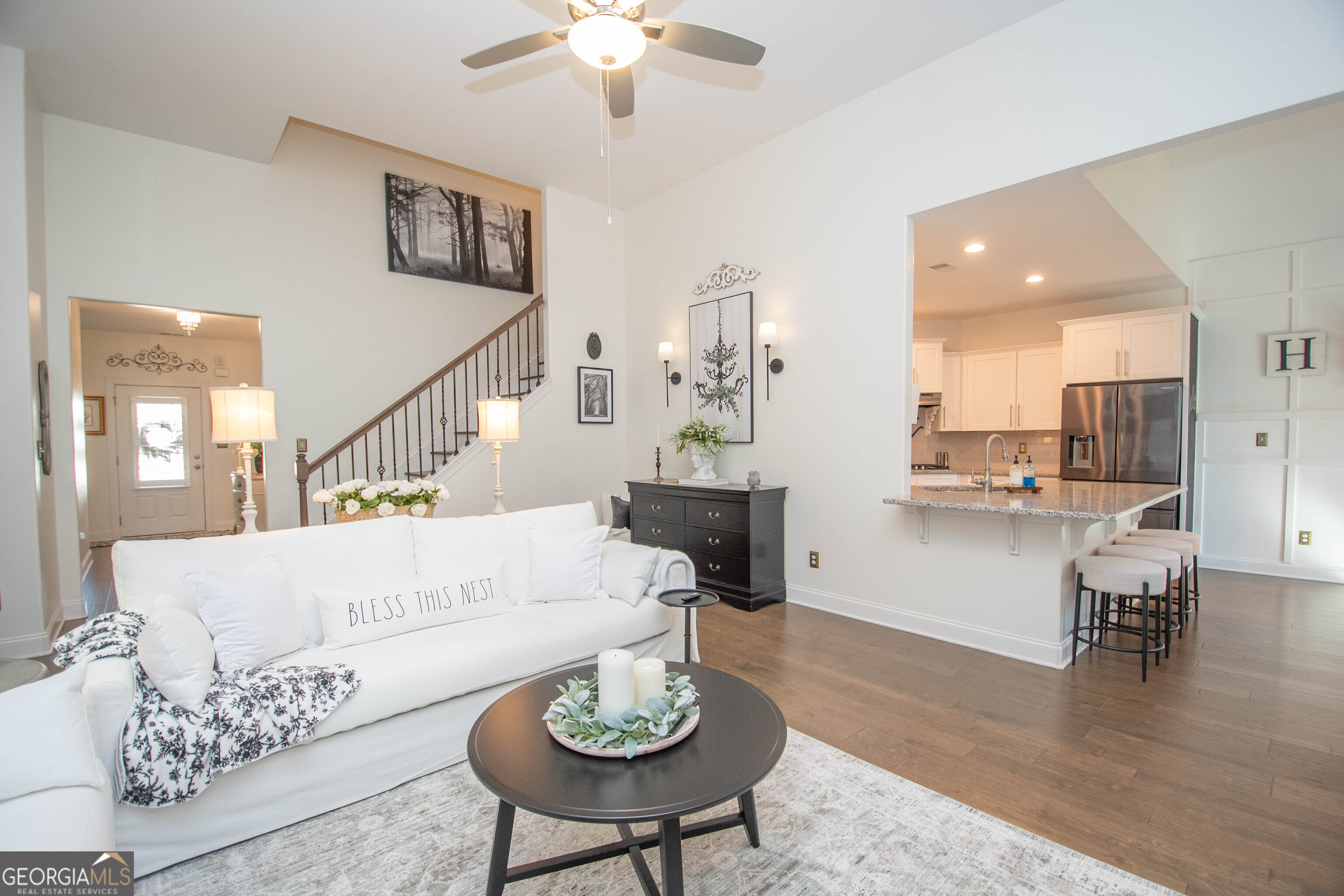 6 Delaware Way Newnan, GA 30265 - Photo 11 of 42 a living room with furniture and a wooden floor