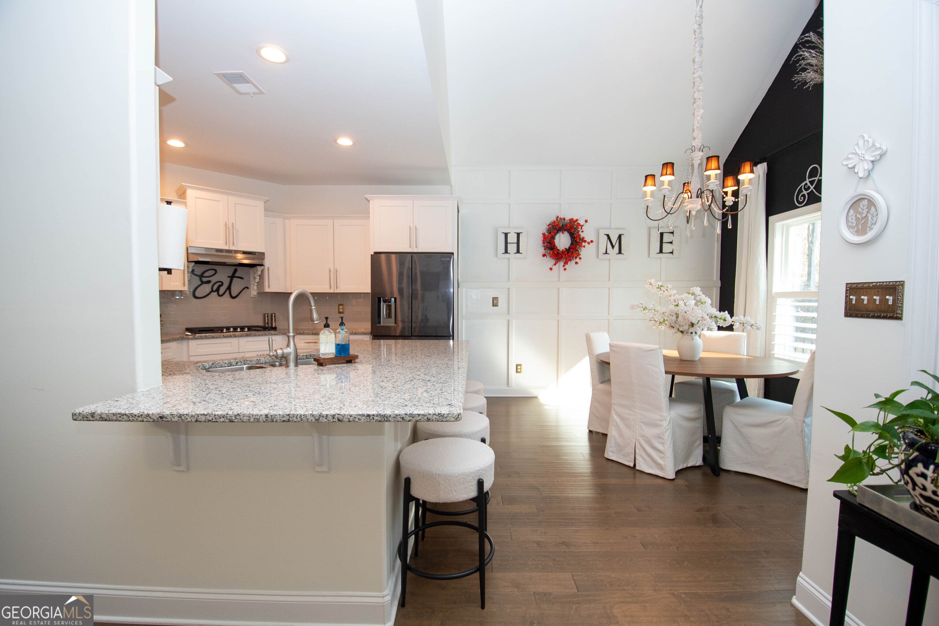 6 Delaware Way Newnan, GA 30265 - Photo 12 of 42 a kitchen with stainless steel appliances granite countertop a sink and a refrigerator
