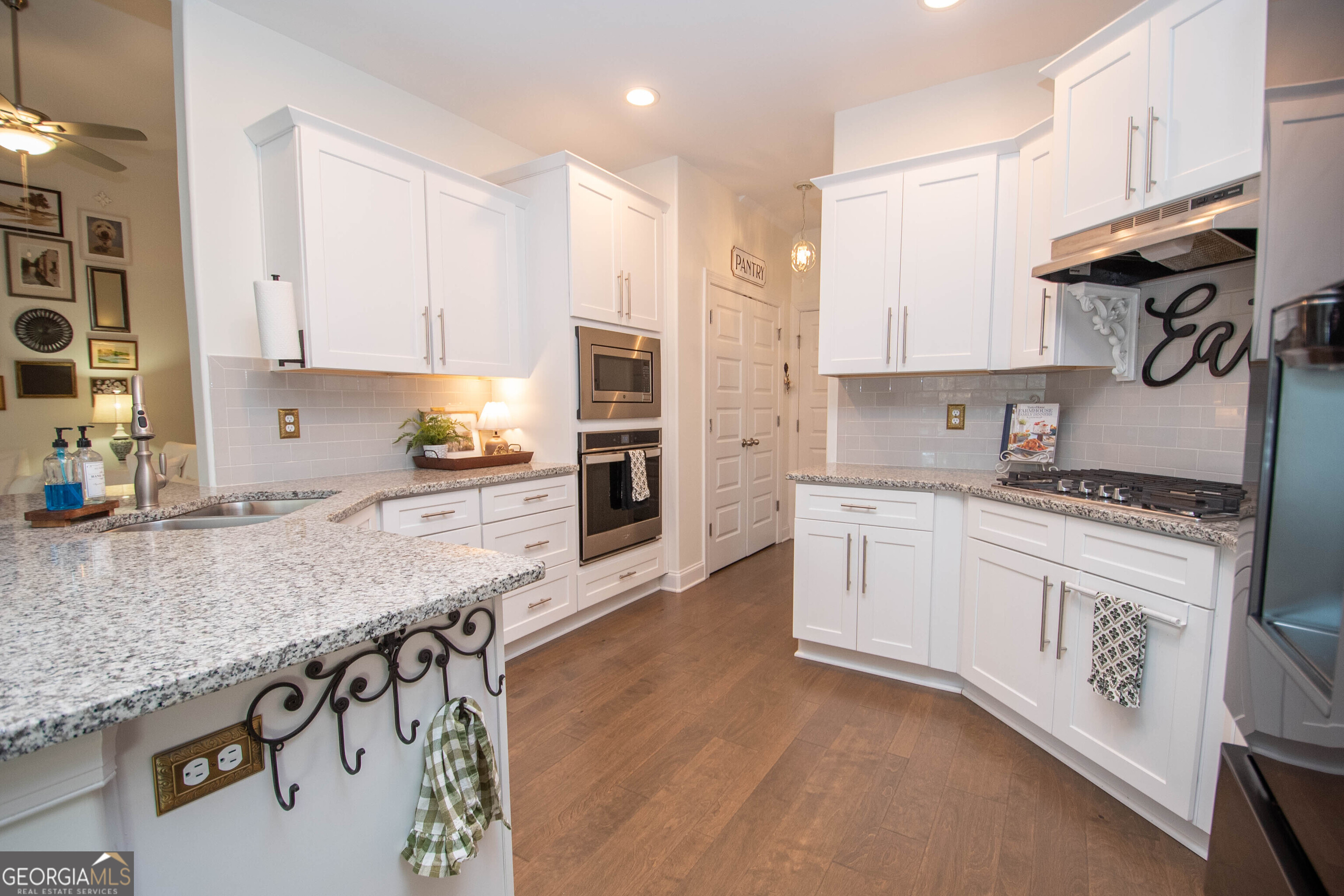 6 Delaware Way Newnan, GA 30265 - Photo 17 of 42 a kitchen with stainless steel appliances granite countertop a sink a stove and a refrigerator