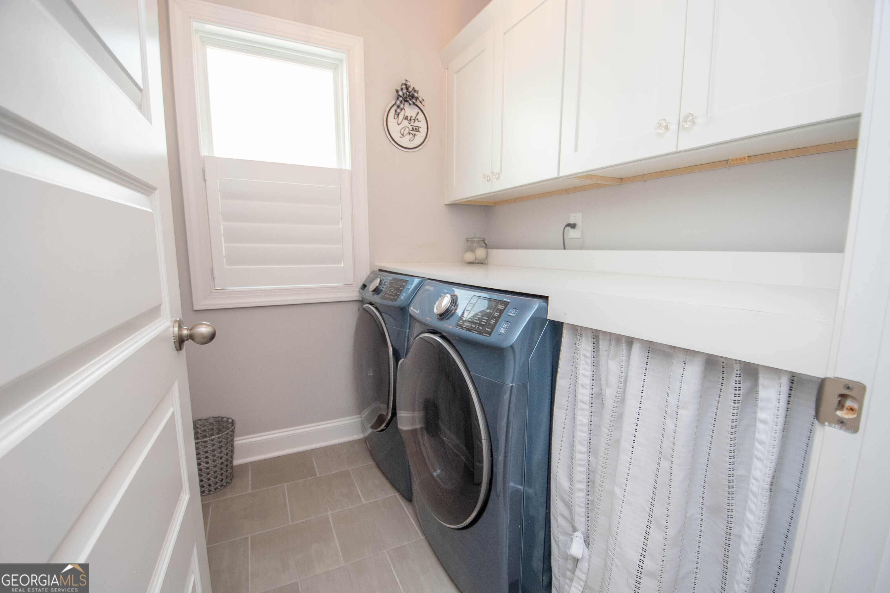 6 Delaware Way Newnan, GA 30265 - Photo 21 of 42 a utility room with dryer and washer