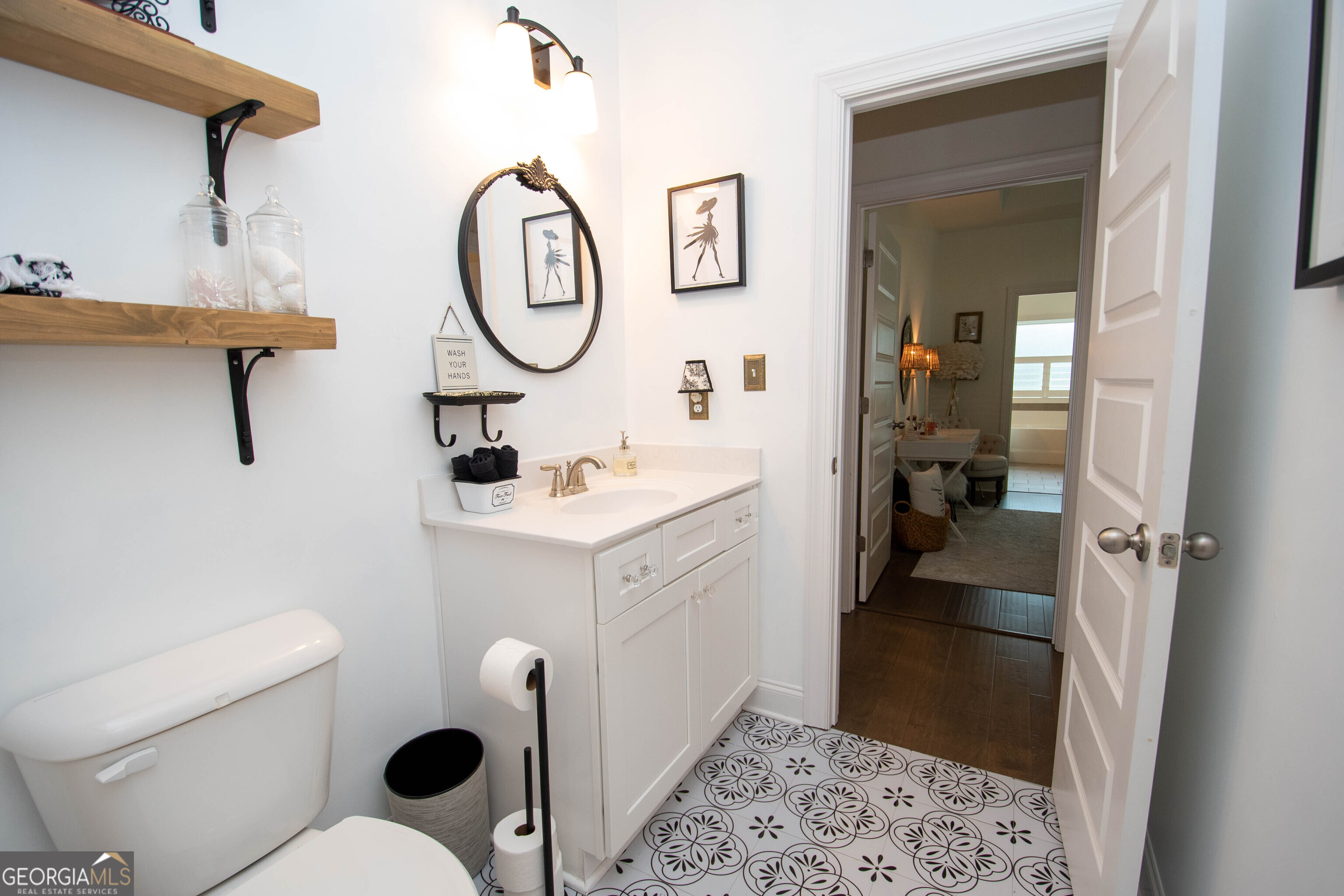 6 Delaware Way Newnan, GA 30265 - Photo 26 of 42 a bathroom with a toilet a sink and a mirror