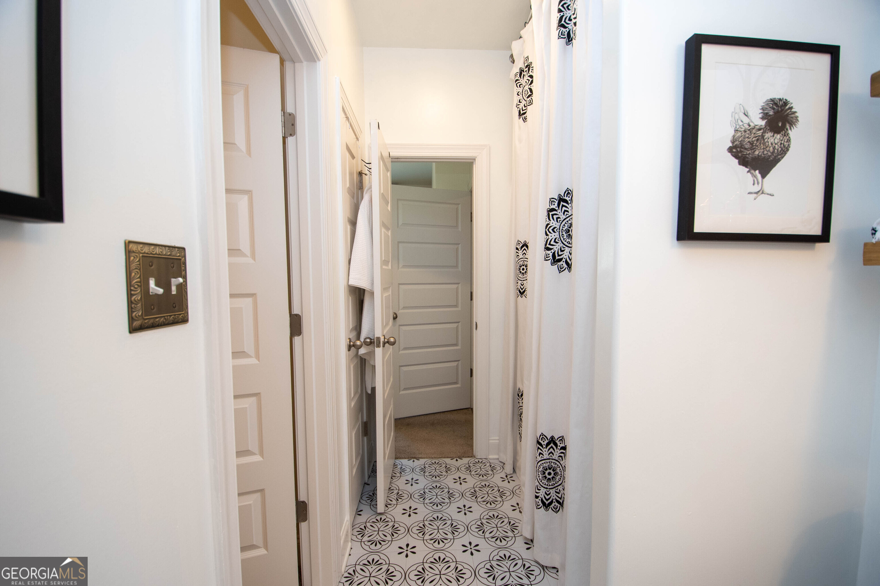 6 Delaware Way Newnan, GA 30265 - Photo 27 of 42 a view of a hallway with paintings on the wall